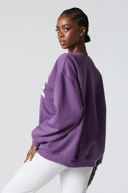 0706-39071701-oversized-destination-chenille-embroidered-fleece-sweatshirt